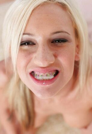 Young woman doll with braces jizz