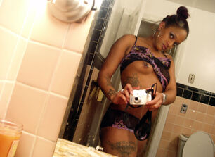 Tattoed virgin black taking photos